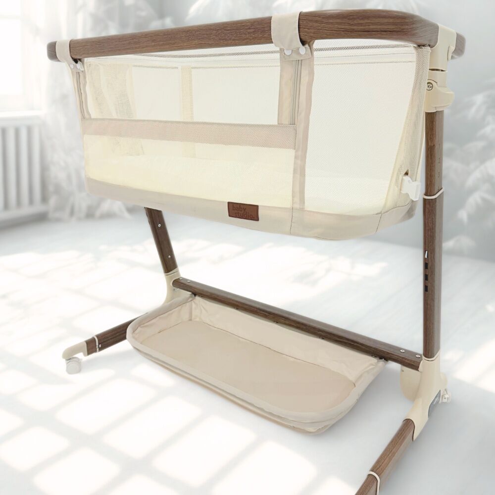 Baby Studio Dream Glider Bassinet Lockable Wheels Wood Grain