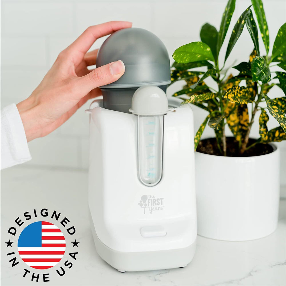 The First Years Quick Serve Bottle Warmer with pacifier sanitizer