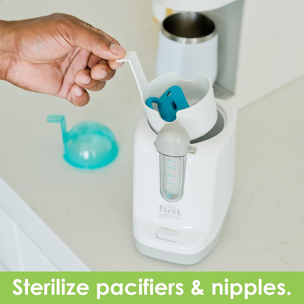 The First Years Quick Serve Bottle Warmer with pacifier sanitizer